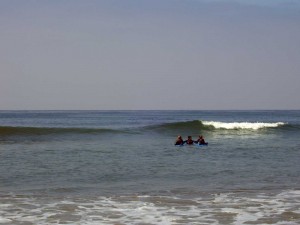 The surf instructor taking my kids out to the next wave. 