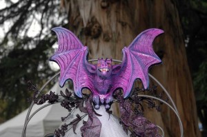 The wedding trellis is topped by a gorgeous bat.